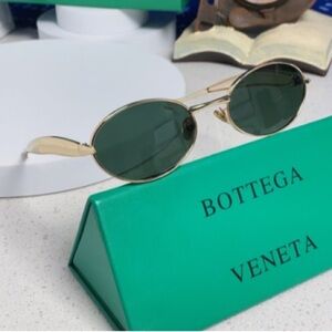 Bottega Veneta Gold Frame Sunglasses with Dark Green Lenses